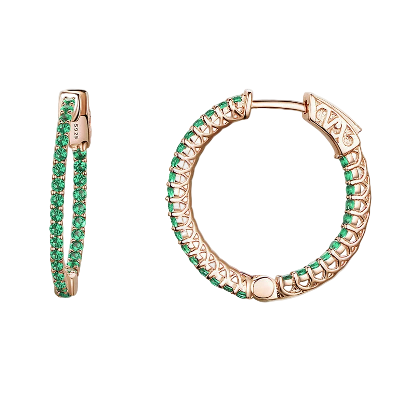 Rose gold hoop earrings with green gemstones on a white background