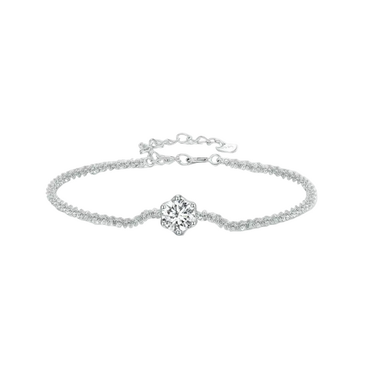 Silver bracelet with a diamond on a white background