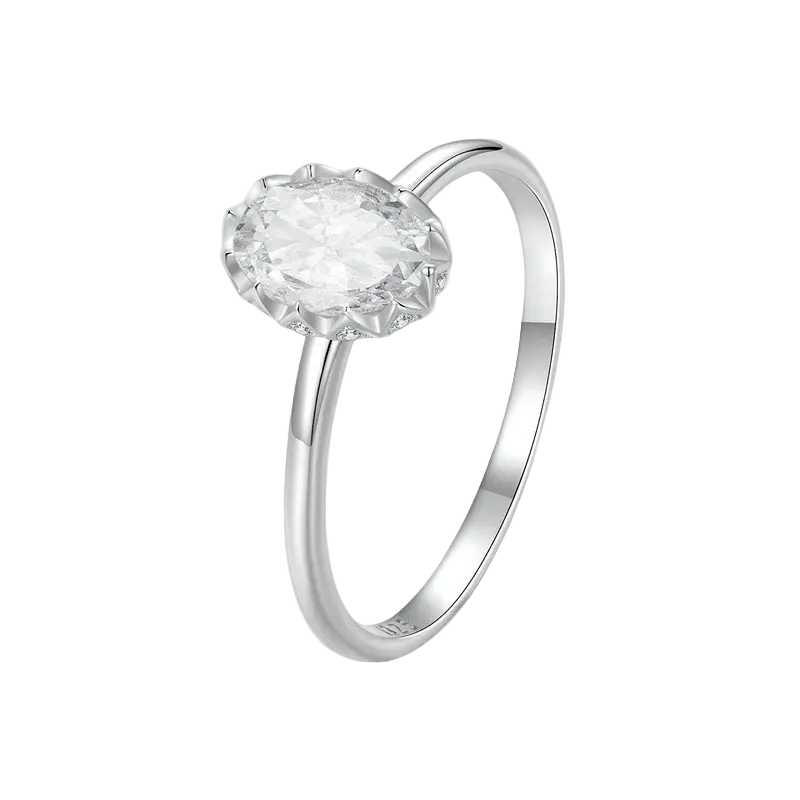 Silver ring with a clear gemstone on a white background