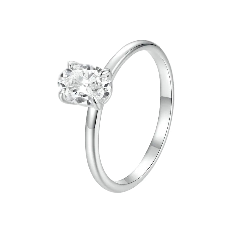 Silver ring with a clear gemstone on a white background